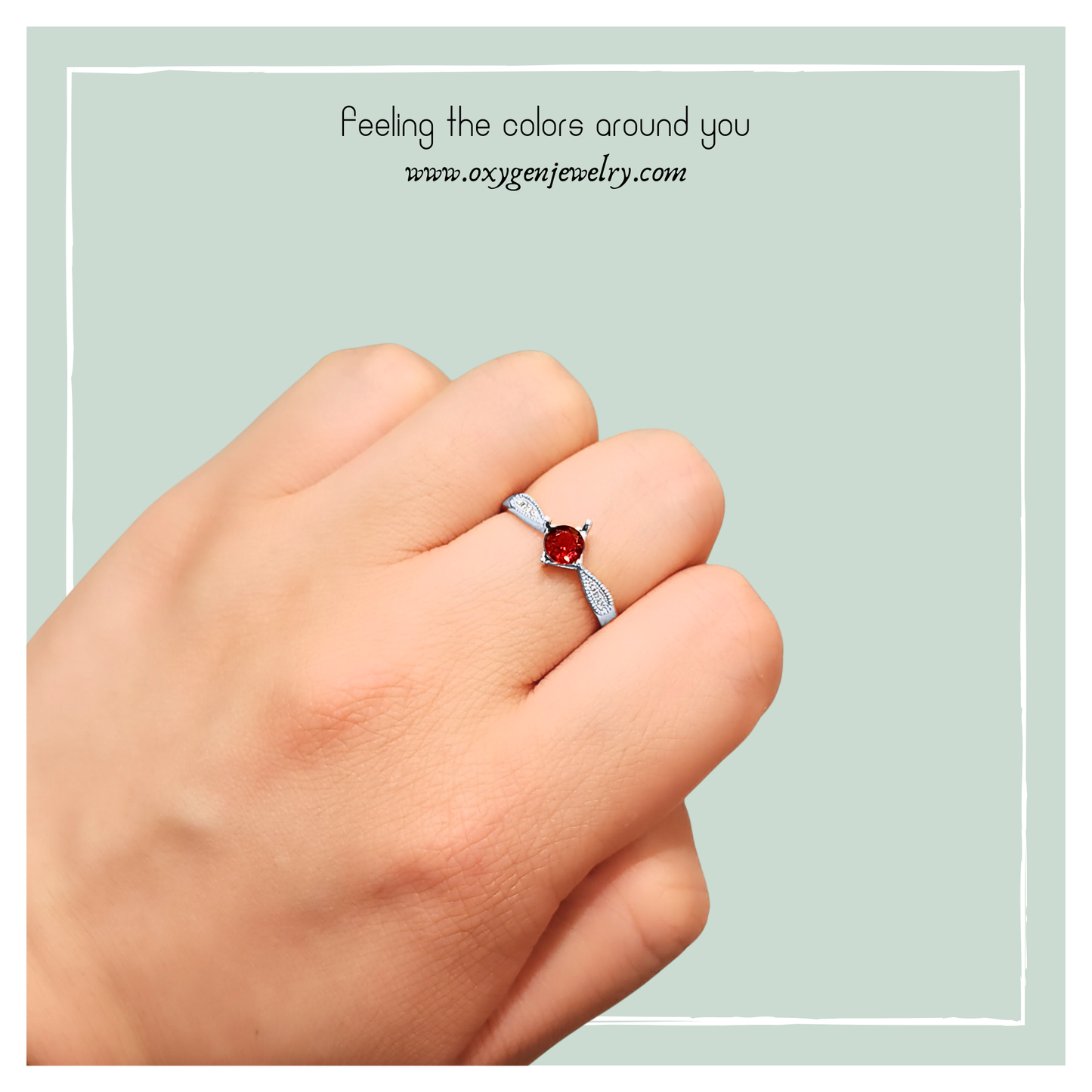 椭圆石榴石配圆锆石戒指