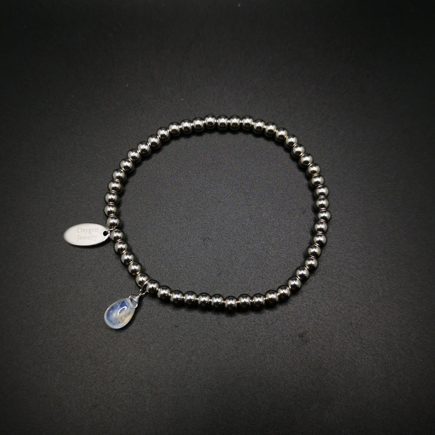 月亮石梨形旦面金屬珠彈性手鏈